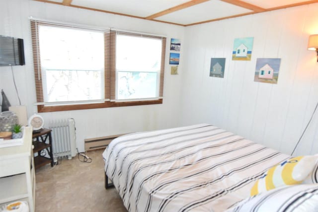 carpeted bedroom featuring a baseboard heating unit and radiator heating unit