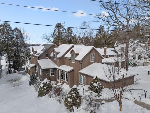 704 Fromm Ln, Elkhart Lake, WI 53020 - view of snowy exterior with a chimney