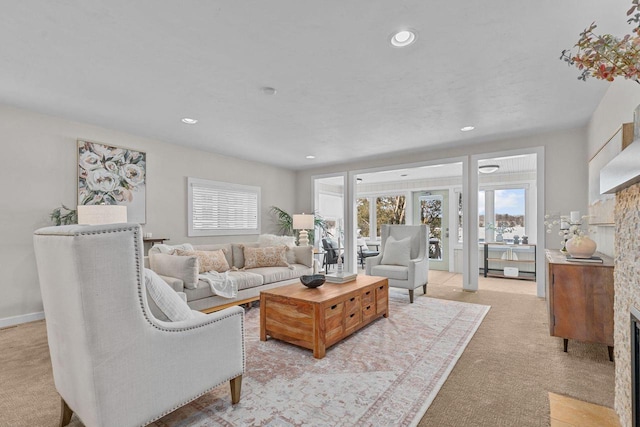 704 Fromm Ln, Elkhart Lake, WI 53020 - living room with a fireplace, light colored carpet, healthy amount of natural light, and recessed lighting