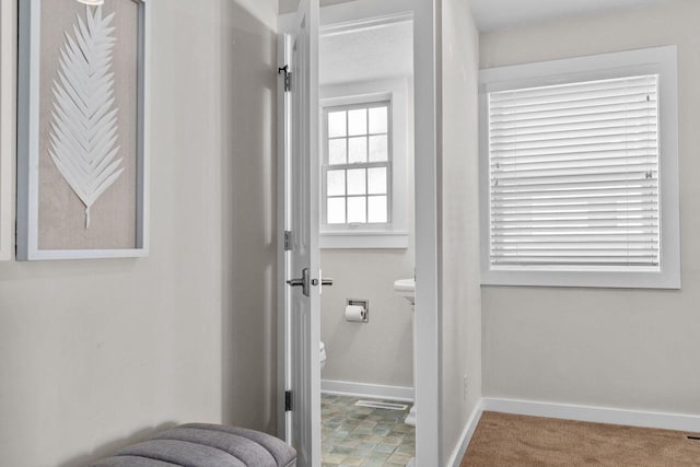 704 Fromm Ln, Elkhart Lake, WI 53020 - bathroom featuring baseboards and toilet