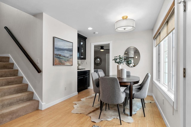 704 Fromm Ln, Elkhart Lake, WI 53020 - dining area featuring light wood-type flooring, baseboards, stairs, recessed lighting, and a ceiling fan