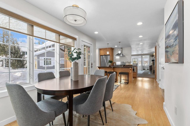 704 Fromm Ln, Elkhart Lake, WI 53020 - dining space with baseboards, recessed lighting, light wood-style flooring, and french doors