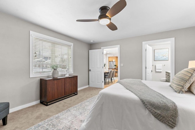 704 Fromm Ln, Elkhart Lake, WI 53020 - carpeted bedroom featuring baseboards, ceiling fan, and ensuite bathroom