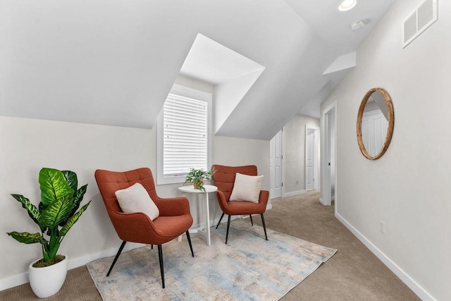 704 Fromm Ln, Elkhart Lake, WI 53020 - sitting room featuring carpet floors, vaulted ceiling, and baseboards