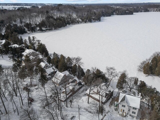 704 Fromm Ln, Elkhart Lake, WI 53020 - snowy aerial view featuring view of scattered trees