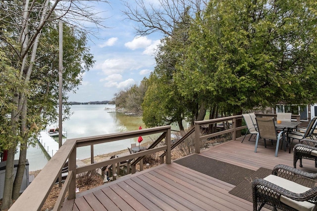 704 Fromm Ln, Elkhart Lake, WI 53020 - wooden deck featuring outdoor dining area and a water view