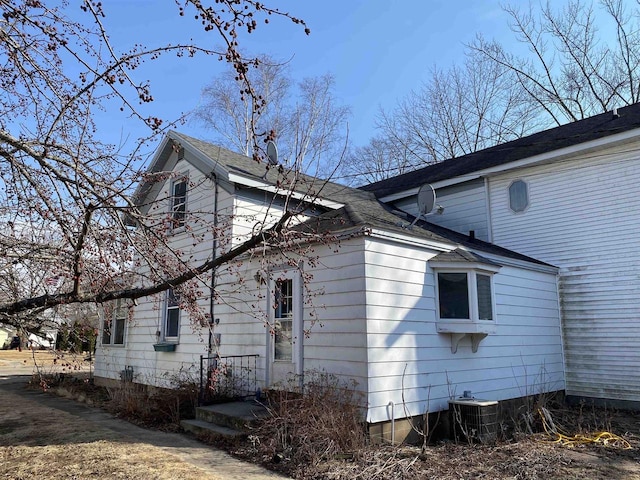 view of side of home featuring central air condition unit