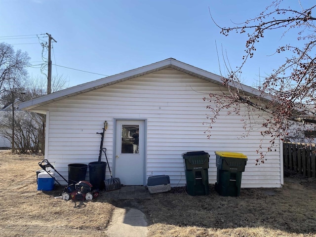 rear view of property with fence