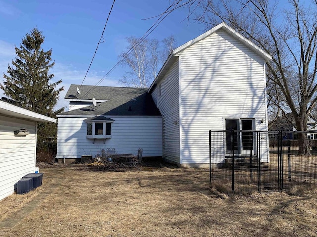 view of side of property featuring fence