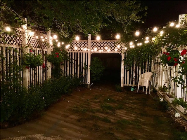 yard at night with fence