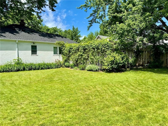 view of yard featuring fence