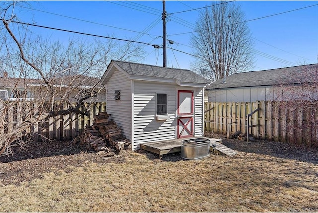 view of shed with fence