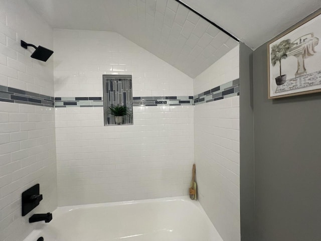 full bathroom with  shower combination and lofted ceiling