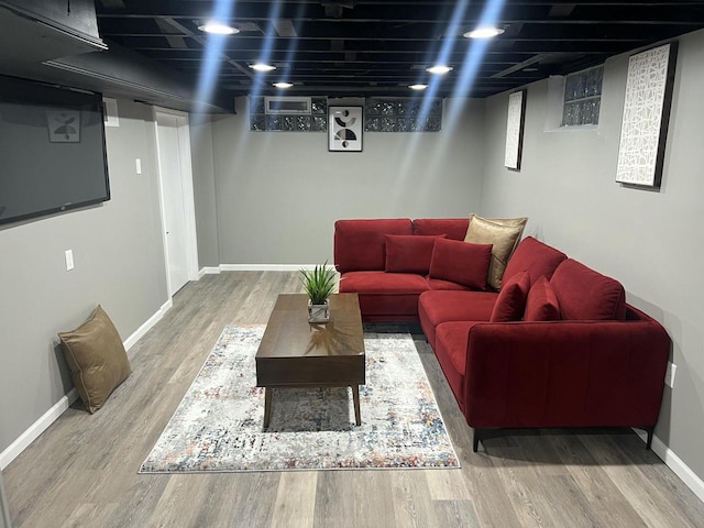 living room with wood finished floors and baseboards