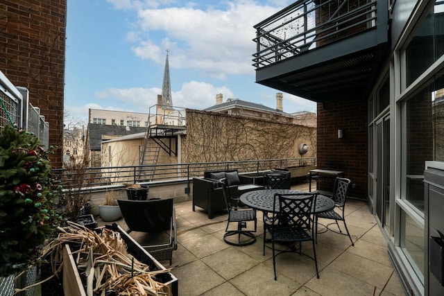 view of patio / terrace with a balcony and an outdoor living space