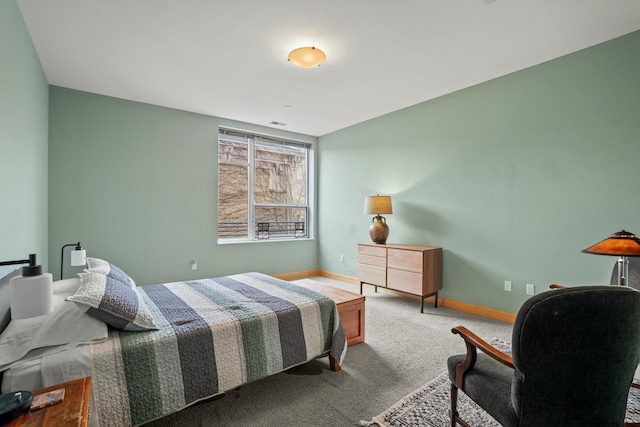 bedroom with carpet floors and baseboards