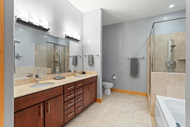 bathroom featuring a sink, baseboards, a bath, double vanity, and a stall shower