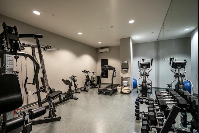 exercise room with recessed lighting and a wall mounted AC