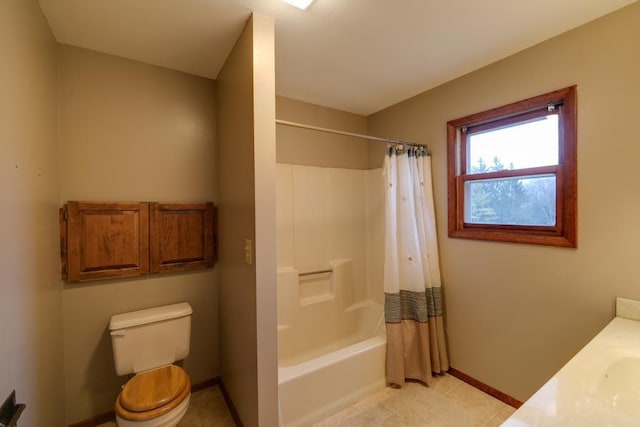 full bath with toilet, tile patterned flooring, baseboards, and shower / tub combo with curtain