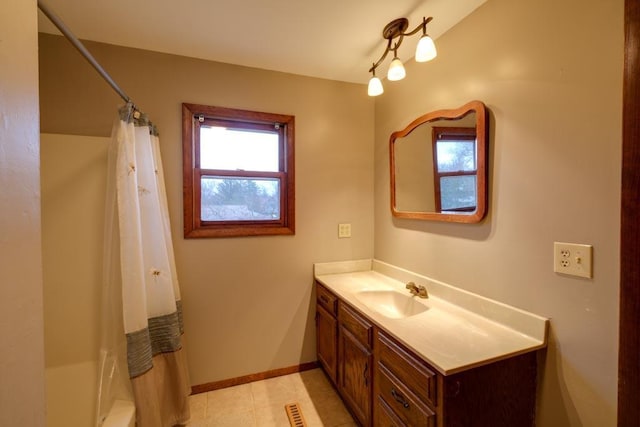 full bathroom with tile patterned floors, visible vents, baseboards, and vanity