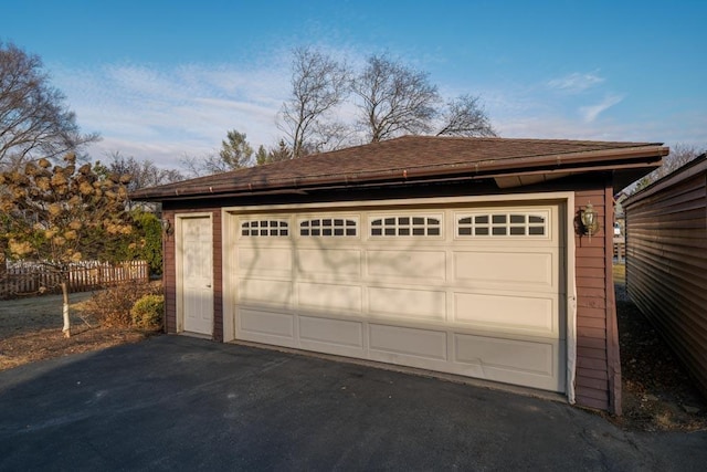 detached garage with fence