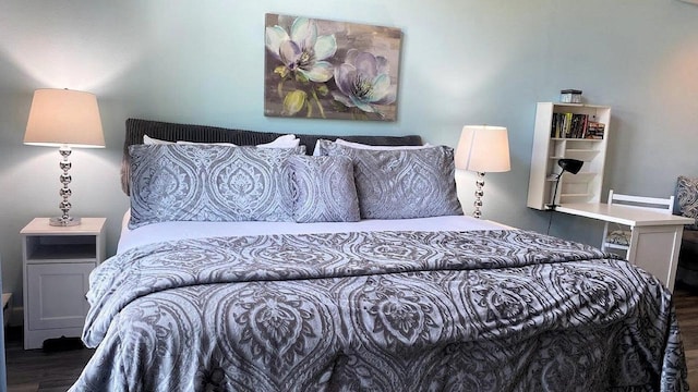 bedroom featuring wood finished floors