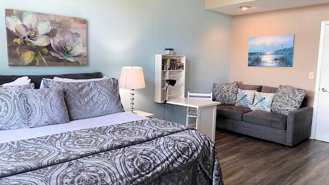 bedroom featuring wood finished floors