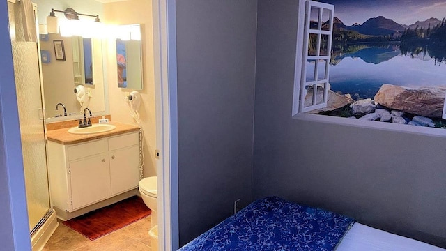 bathroom with tile patterned flooring, a water view, vanity, and toilet