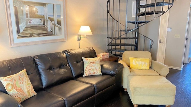 living area with stairway, wood finished floors, and baseboards