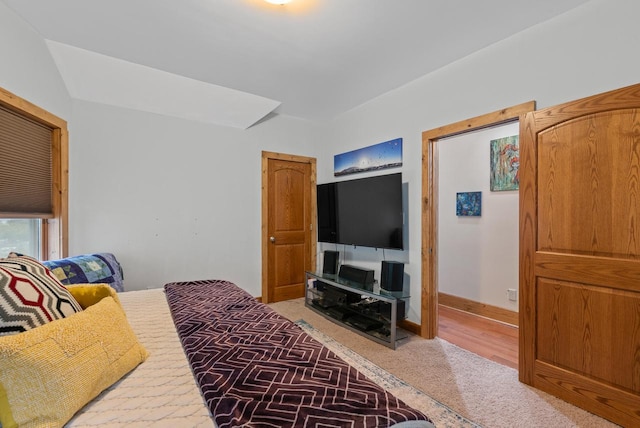 bedroom with carpet floors and baseboards