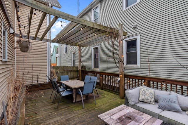 deck featuring an outdoor hangout area, outdoor dining space, and a pergola