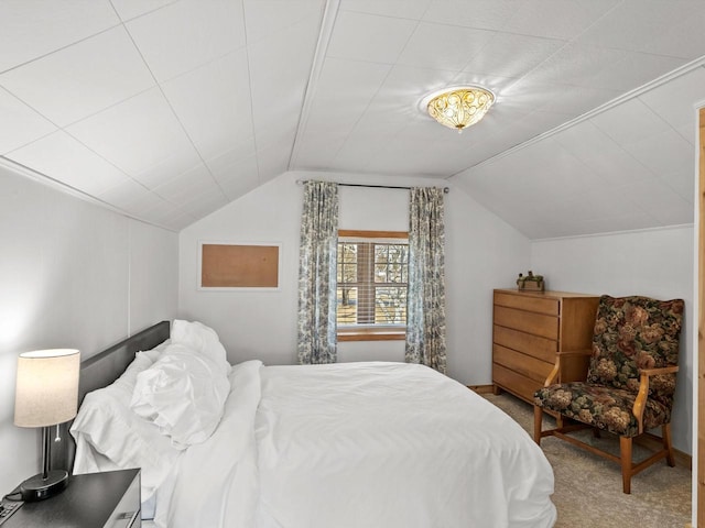 bedroom featuring vaulted ceiling and carpet flooring