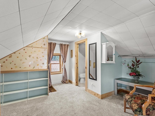 bonus room with carpet floors, baseboards, and lofted ceiling