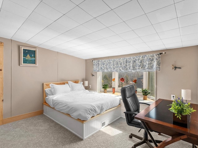 carpeted bedroom featuring vaulted ceiling and baseboards