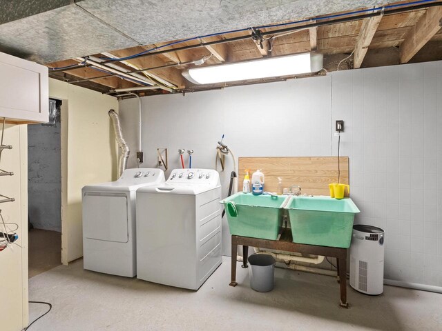 laundry room featuring laundry area, a sink, and washer and dryer