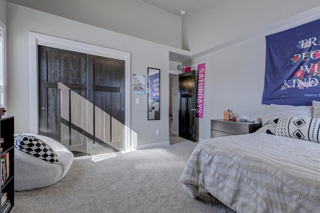 carpeted bedroom featuring baseboards