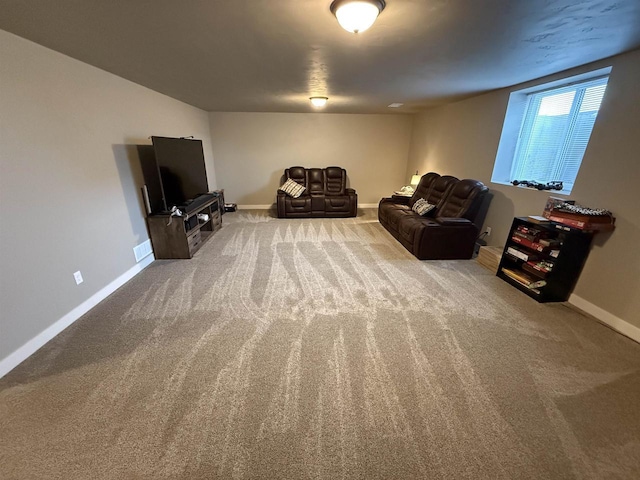 sitting room with carpet flooring and baseboards