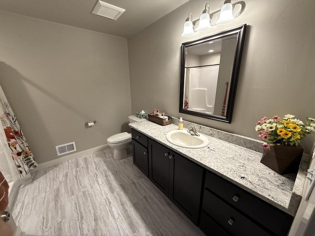 full bathroom featuring baseboards, visible vents, toilet, wood finished floors, and vanity