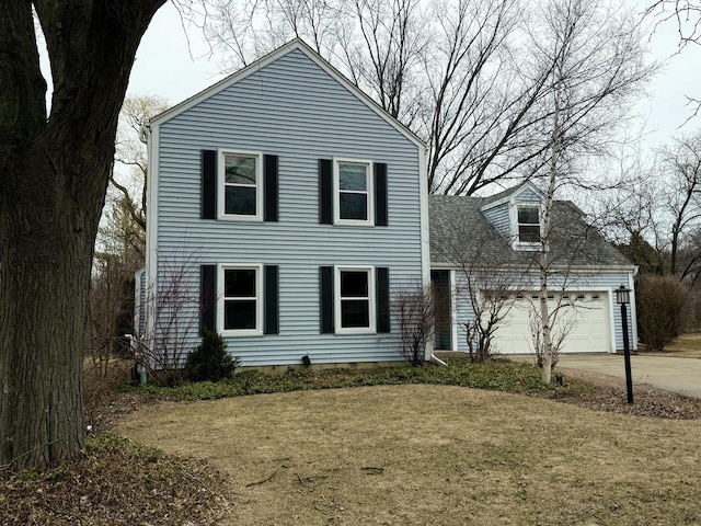 view of front of property featuring an attached garage and concrete driveway