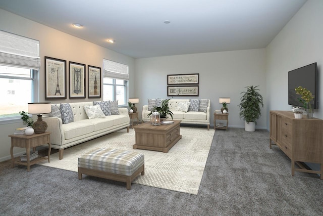 living area featuring a wealth of natural light, carpet flooring, and baseboards