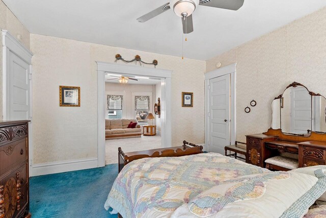 bedroom featuring baseboards, ceiling fan, carpet flooring, and wallpapered walls