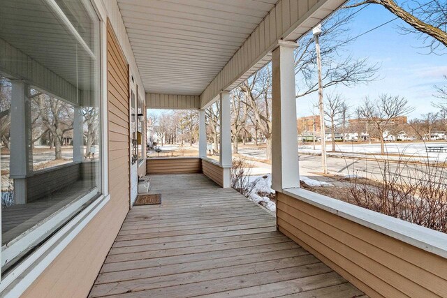 wooden terrace with a porch