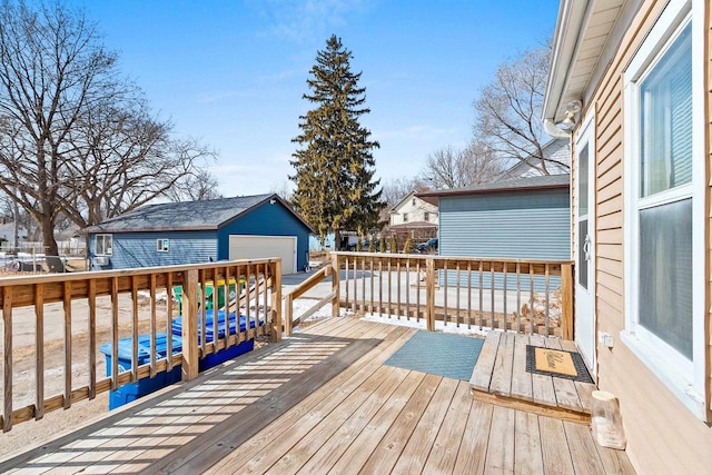 wooden terrace featuring an outbuilding