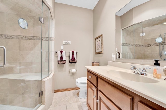 full bathroom featuring toilet, a stall shower, tile patterned flooring, and vanity