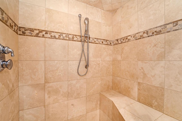 room details with a tile shower