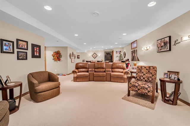 living area with recessed lighting and carpet