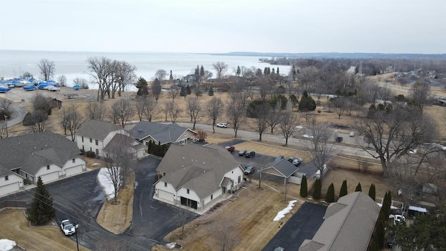 birds eye view of property with a water view and a residential view