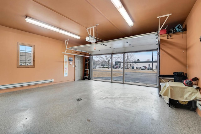 garage featuring baseboard heating and a garage door opener