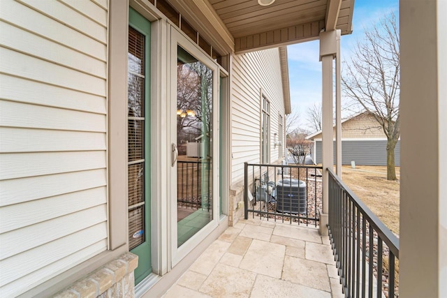 balcony featuring a sunroom and central air condition unit