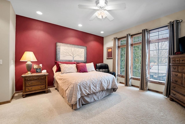 bedroom with an accent wall, recessed lighting, carpet, and baseboards